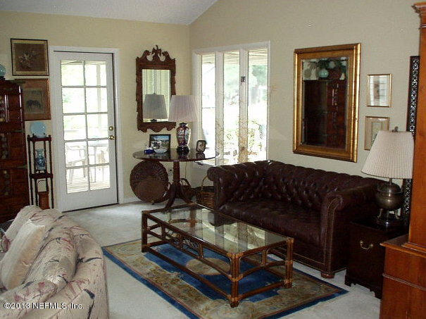 9 Players Club Villas Road Ponte Vedra Beach, FL 32082 - Photo 12 of 21 a living room with furniture rug and window