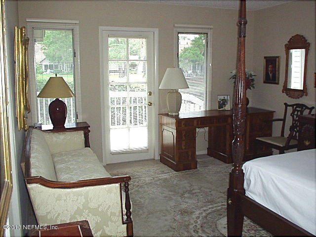 9 Players Club Villas Road Ponte Vedra Beach, FL 32082 - Photo 14 of 21 a living room with furniture and a large window