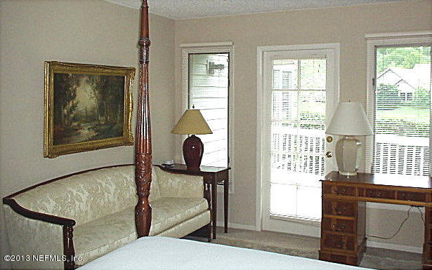 9 Players Club Villas Road Ponte Vedra Beach, FL 32082 - Photo 15 of 21 a living room with furniture and a window