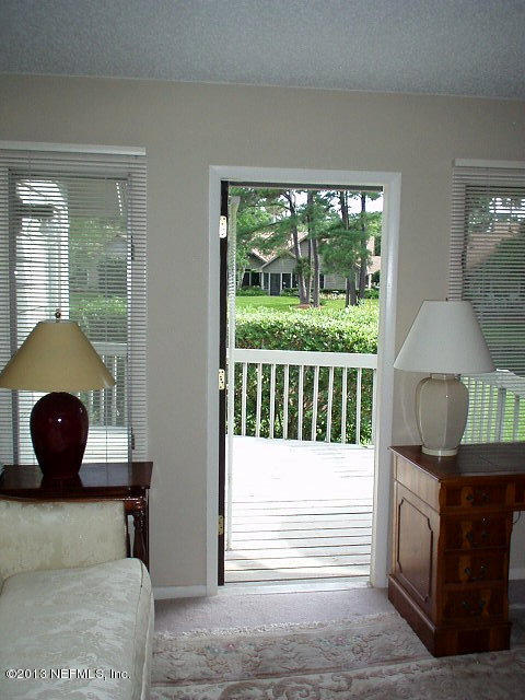 9 Players Club Villas Road Ponte Vedra Beach, FL 32082 - Photo 16 of 21 a bedroom with a bed and a window
