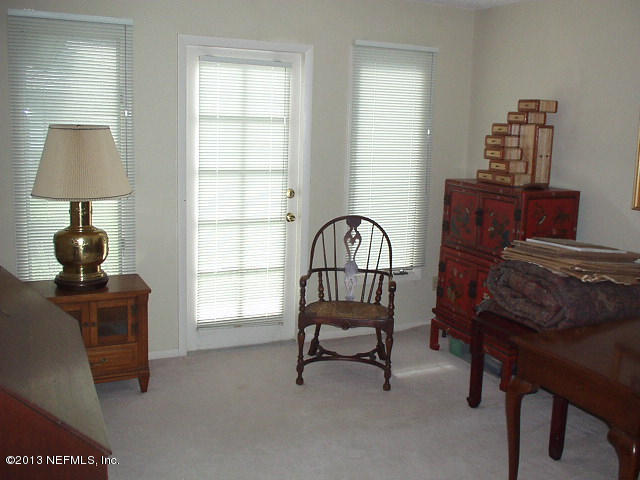 9 Players Club Villas Road Ponte Vedra Beach, FL 32082 - Photo 20 of 21 a living room with furniture and a window