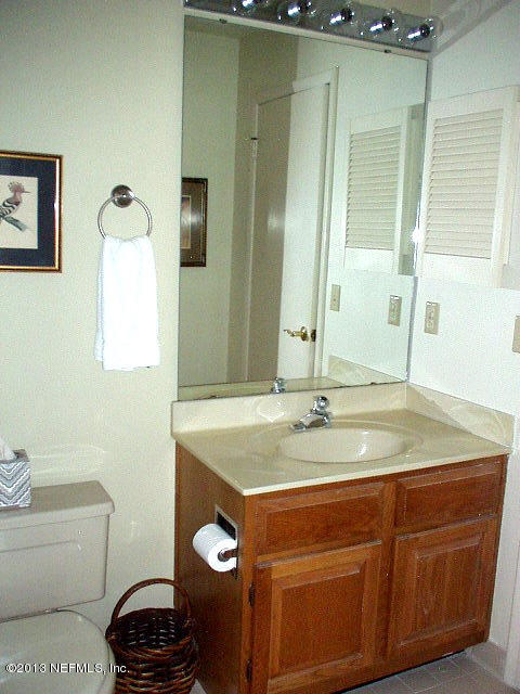 9 Players Club Villas Road Ponte Vedra Beach, FL 32082 - Photo 21 of 21 a bathroom with a granite countertop sink and a mirror