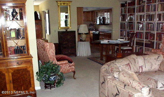 9 Players Club Villas Road Ponte Vedra Beach, FL 32082 - Photo 4 of 21 a living room with furniture a flat screen tv and a refrigerator
