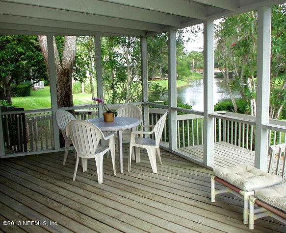 9 Players Club Villas Road Ponte Vedra Beach, FL 32082 - Photo 7 of 21 a view of a dining room and wooden floor