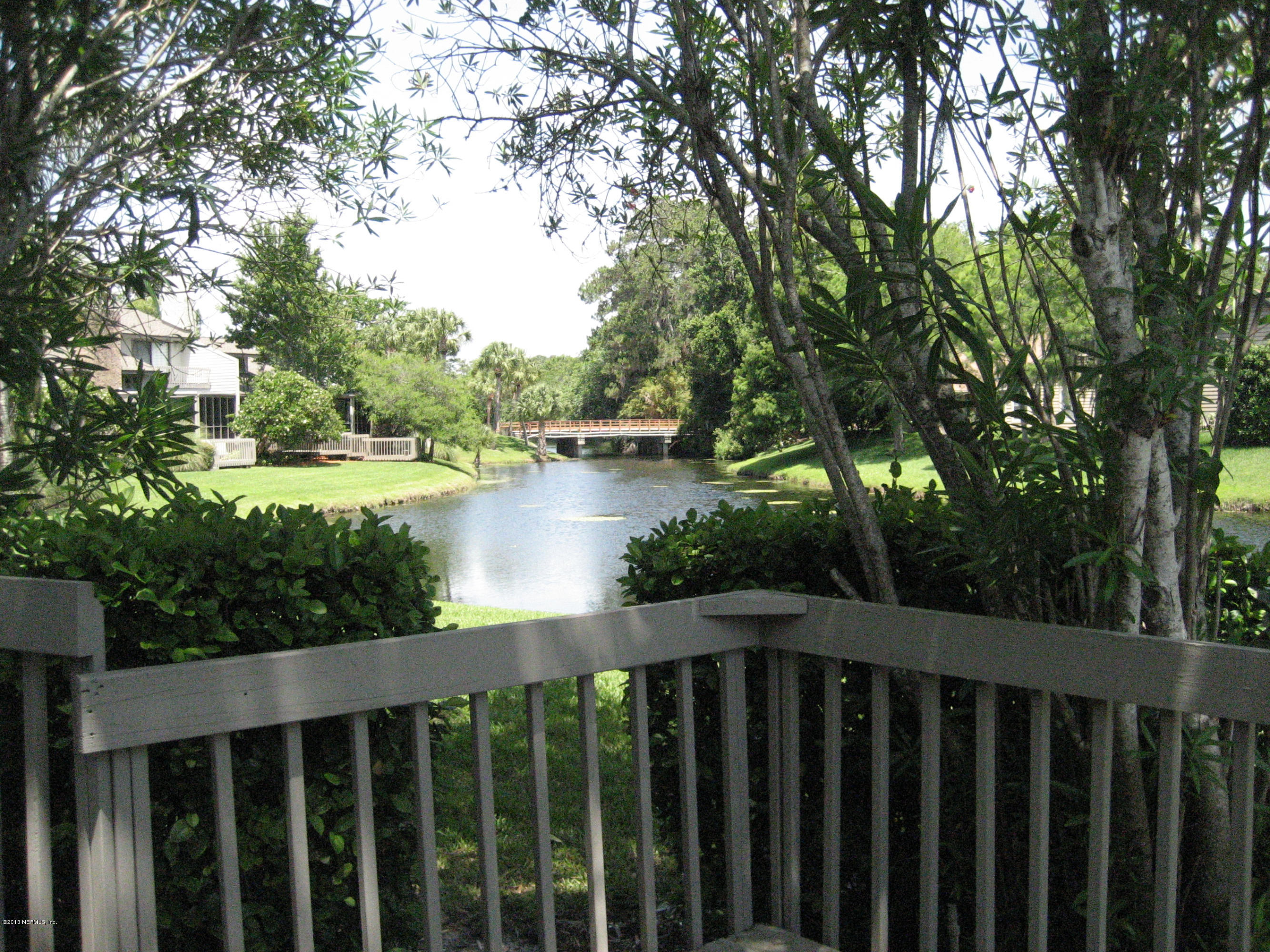9 Players Club Villas Road Ponte Vedra Beach, FL 32082 - Photo 8 of 21 a wooden deck with trees in front of it