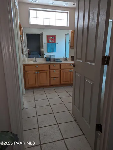 a bathroom with a sink a mirror and a toilet