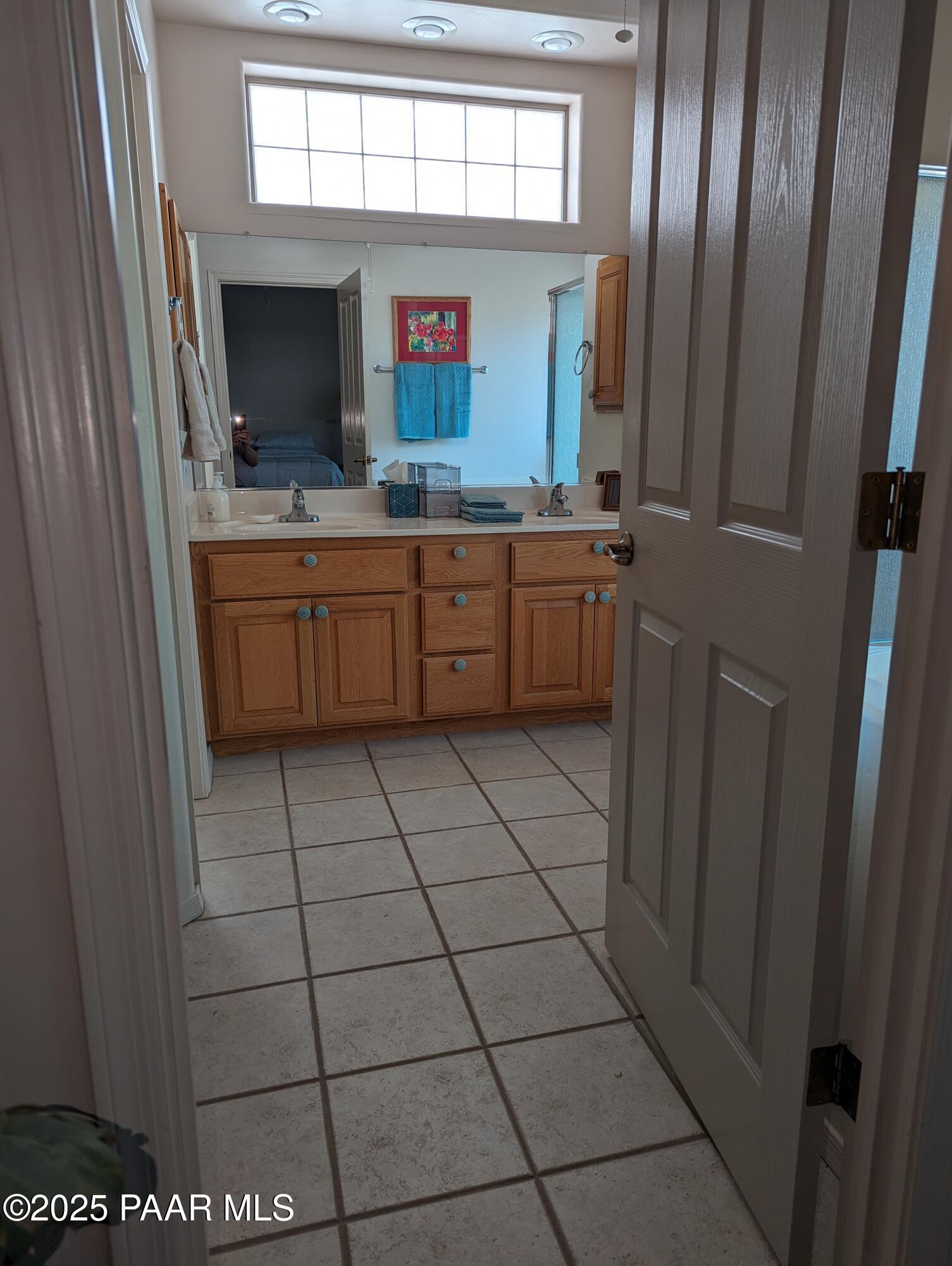 2365 Sequoia Drive Prescott, AZ 86301 - Photo 11 of 17 a bathroom with a sink a mirror and a toilet