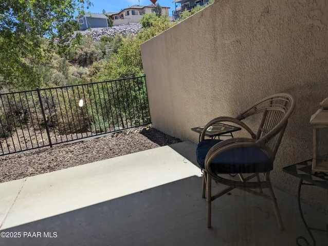 a view of a balcony with chairs