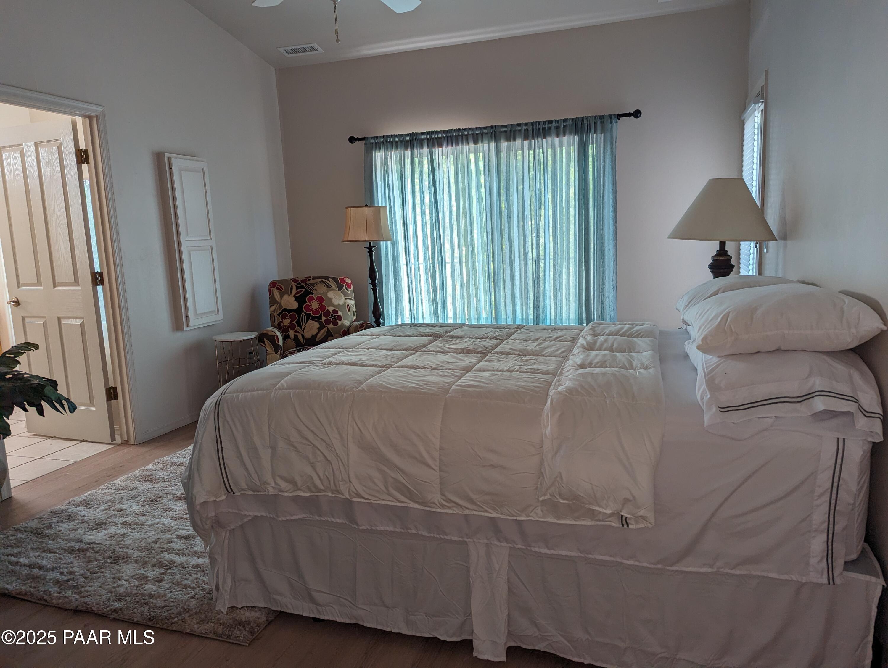 2365 Sequoia Drive Prescott, AZ 86301 - Photo 3 of 17 a bed sitting in a bedroom next to a window