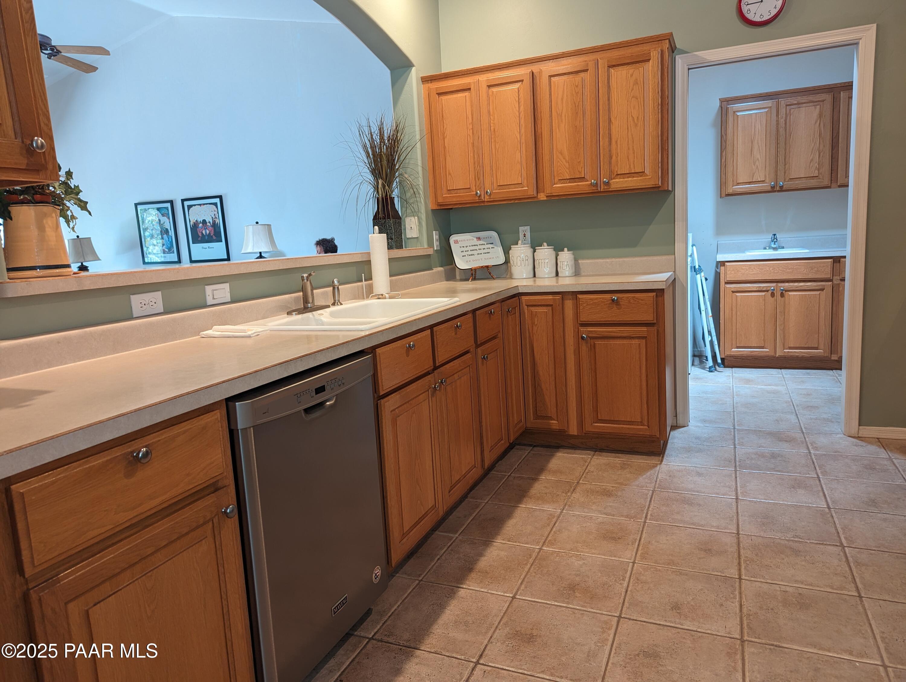 2365 Sequoia Drive Prescott, AZ 86301 - Photo 6 of 17 a kitchen with stainless steel appliances a sink stove and cabinets
