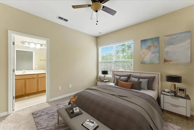 a bathroom with a double vanity sink toilet and a mirror