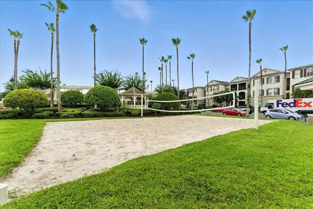 a view of a park with large trees