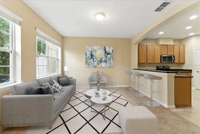 a view of a kitchen with microwave and cabinets