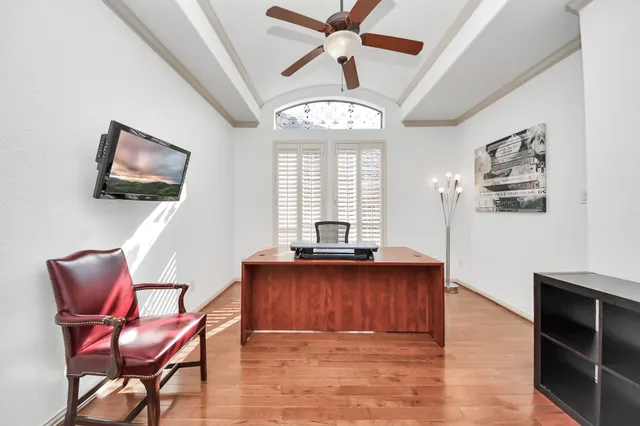 a view of a livingroom with furniture window and wooden floor