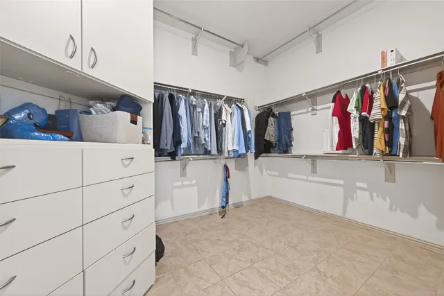 a bedroom with furniture and a chandelier