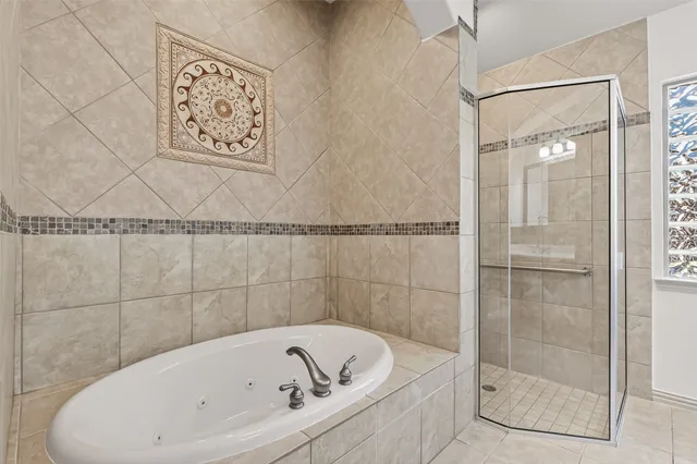 a bathroom with a bathtub a mirror a double vanity sink and vanity