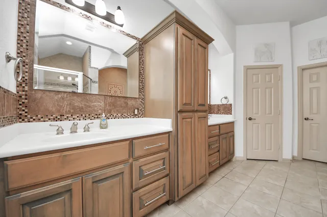 a bathroom with a bathtub and shower