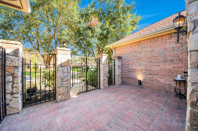 a view of an outdoor space with wooden fence
