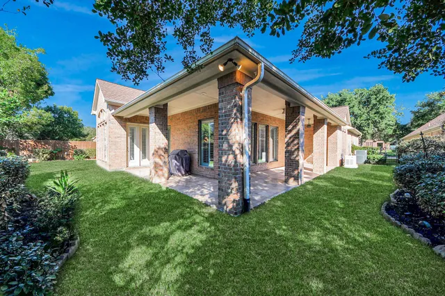 a front view of a house with a yard and porch