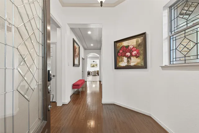 a view of an entryway with wooden floor