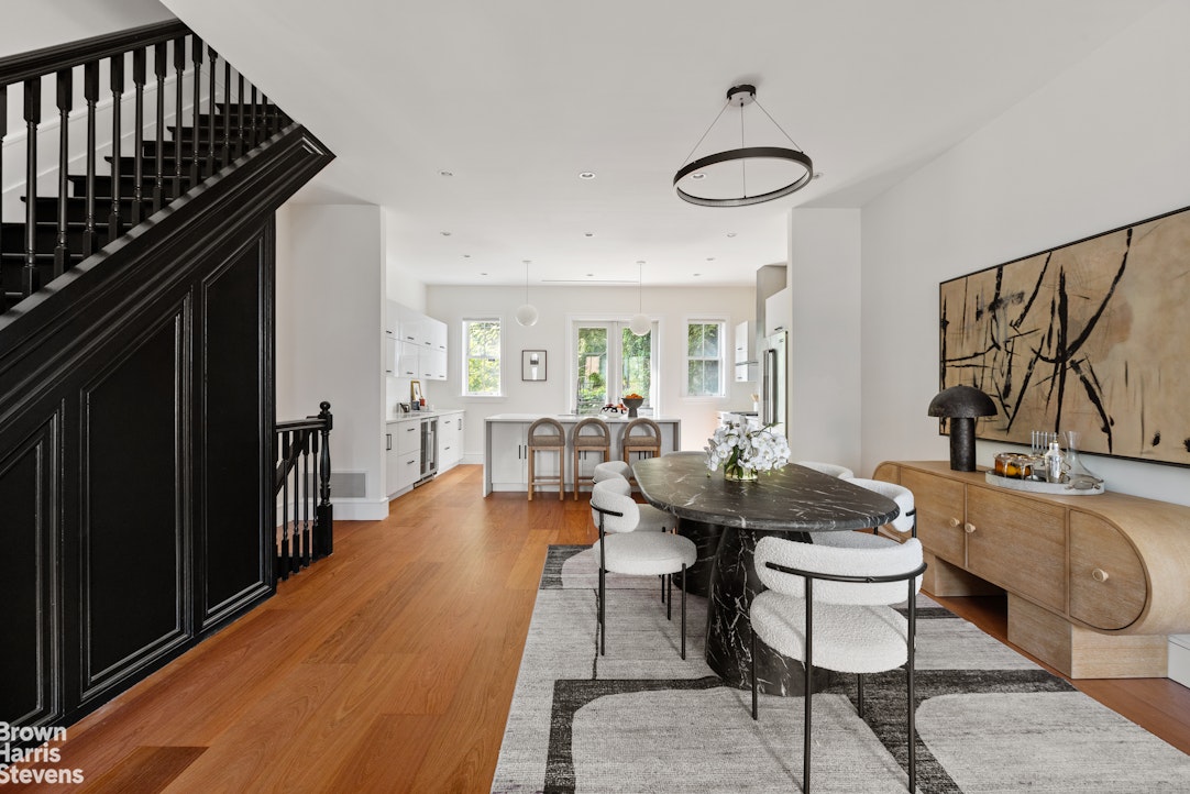 210 Macon Street Brooklyn, NY 11216 - Photo 3 of 13 a dining room with furniture and wooden floor