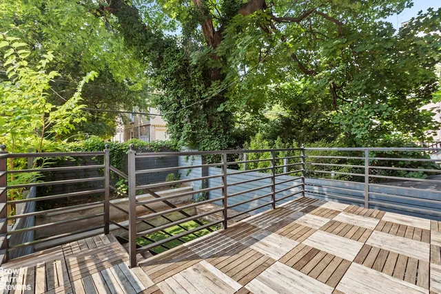 a kitchen with granite countertop a dining table chairs appliances and cabinets
