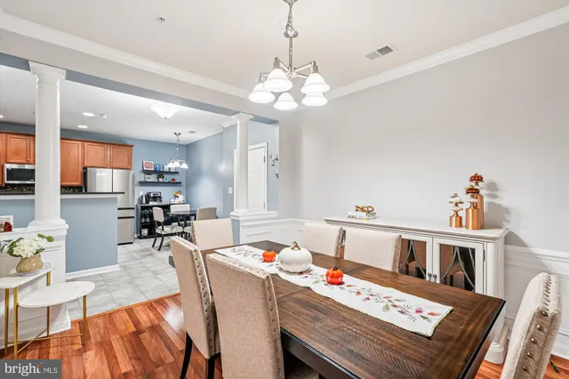 a very nice looking dining room with a table and chairs