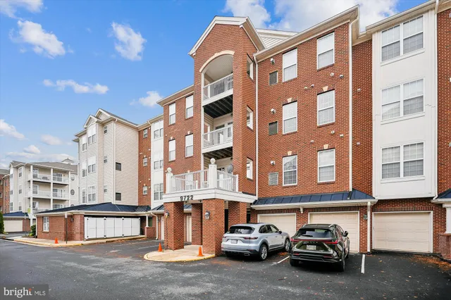 a couple of cars parked in front of a building