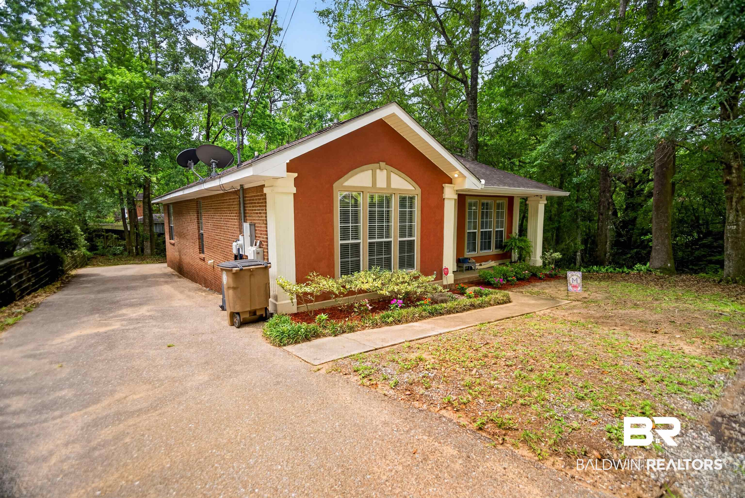 5913 Antoine Road Mobile, AL 36693 - Photo 2 of 33 Stucco and brick exterior with a pitched roof