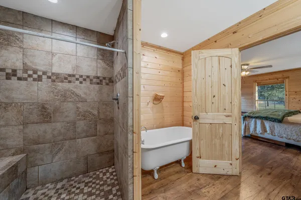 a view of a livingroom with wooden floor and a couch