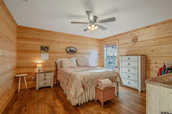 a bedroom with a large bed and a large dresser