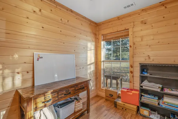 a view of a room with wooden floors and led lights