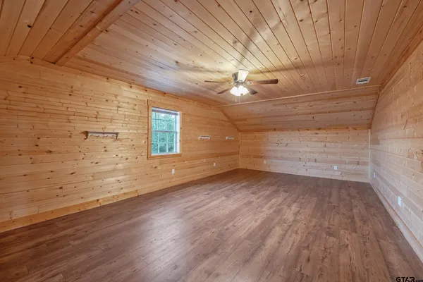 a view of a room with wooden floors and led lights