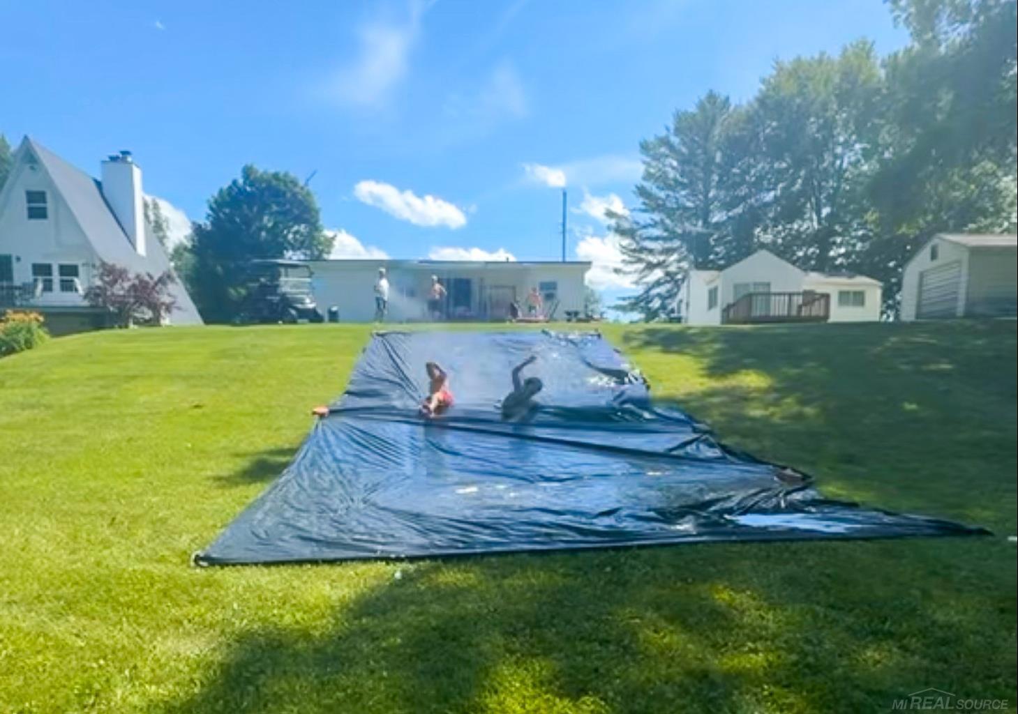 1049 Radov Road Gladwin, MI 48624 - Photo 30 of 40 This homeowner knows how to entertain the teens! GIANT SLIP & SLIDE DOWN THE gentle HILL. Video available upon request.