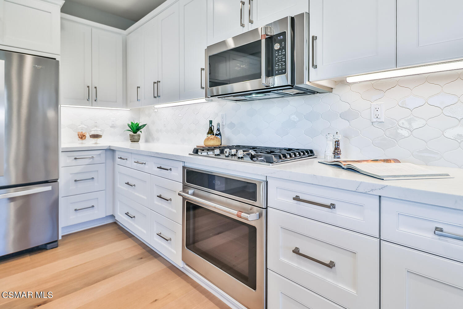 2498 Cherry Tree Drive Camarillo, CA 93012 - Photo 16 of 67 a kitchen with cabinets stainless steel appliances and wooden cabinets