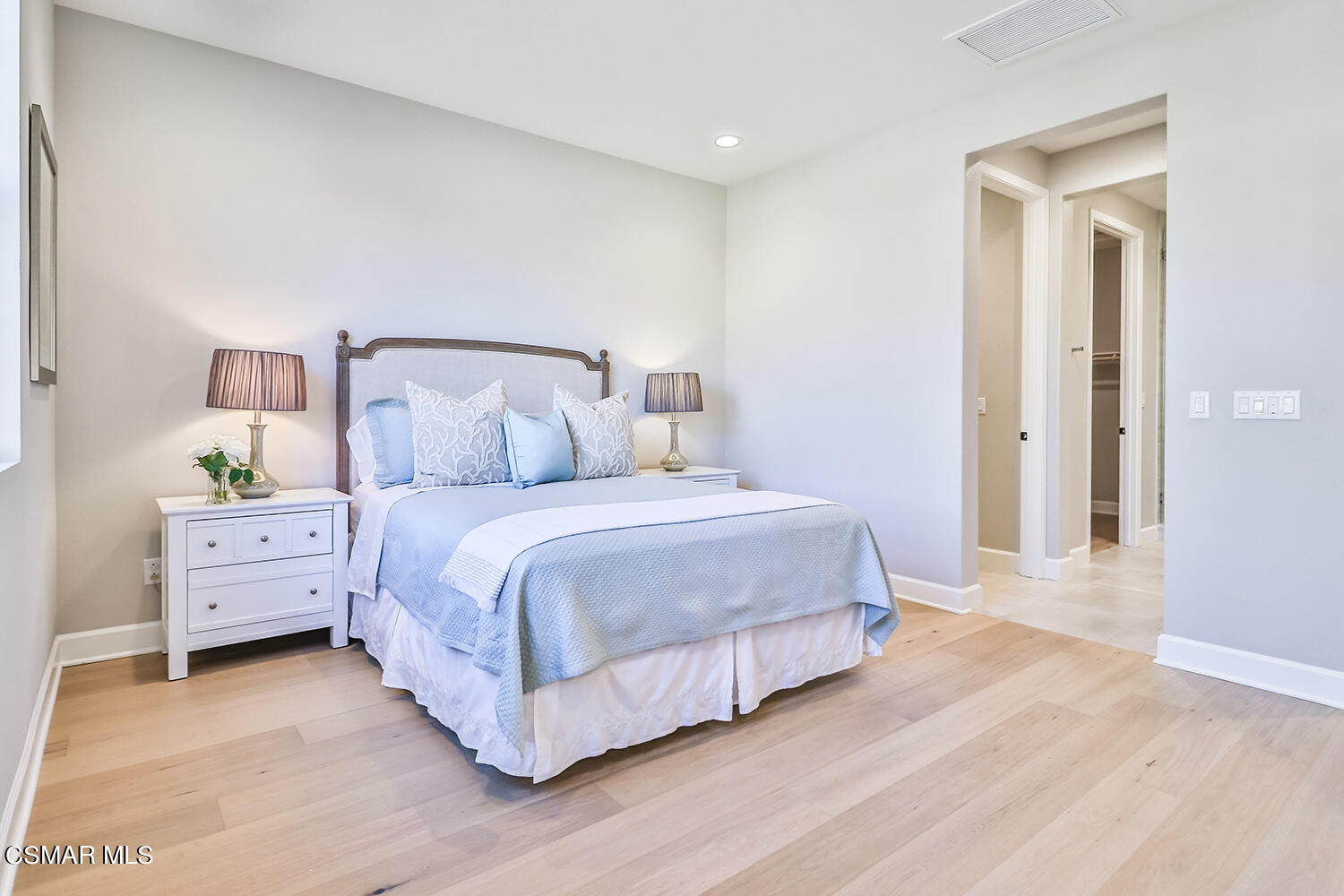 2498 Cherry Tree Drive Camarillo, CA 93012 - Photo 20 of 67 a bedroom with a bed and wooden floor