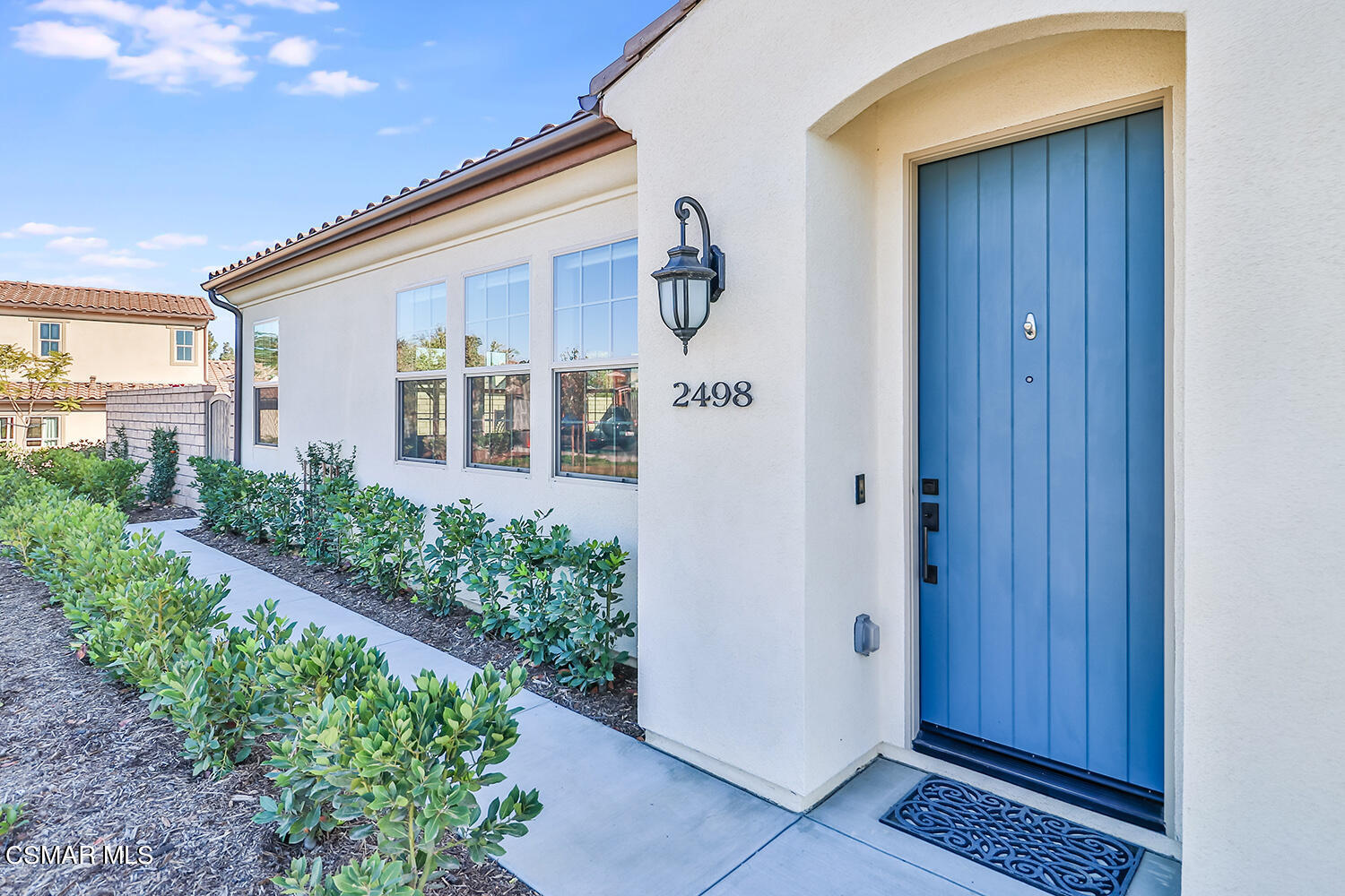 2498 Cherry Tree Drive Camarillo, CA 93012 - Photo 2 of 67 a front view of a house with a yard