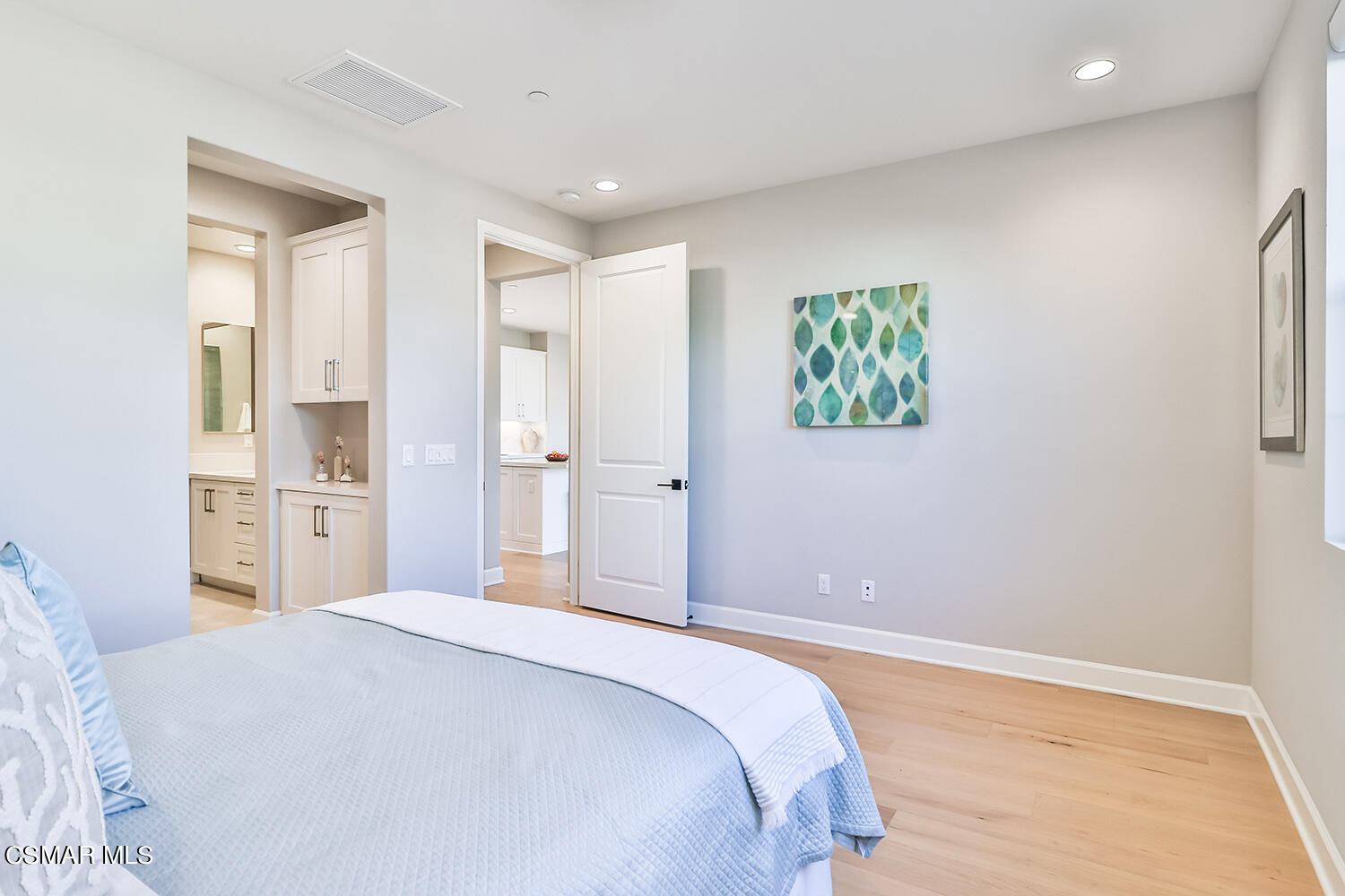 2498 Cherry Tree Drive Camarillo, CA 93012 - Photo 21 of 67 a bedroom with a bed and a painting on the wall