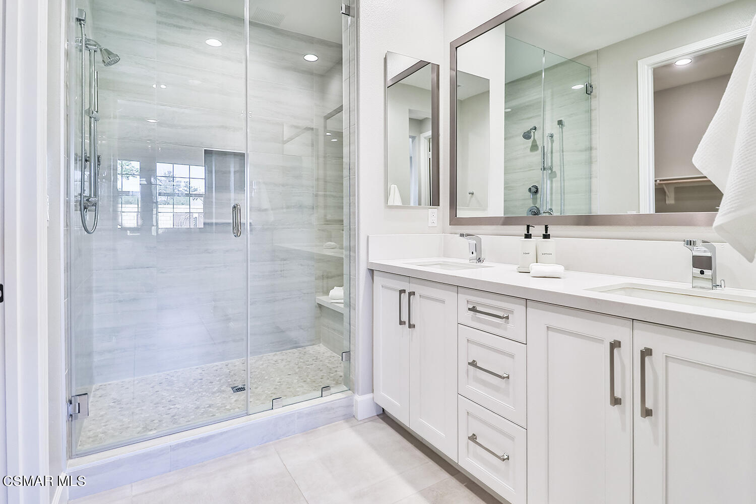 2498 Cherry Tree Drive Camarillo, CA 93012 - Photo 23 of 67 a bathroom with a shower sink and mirror