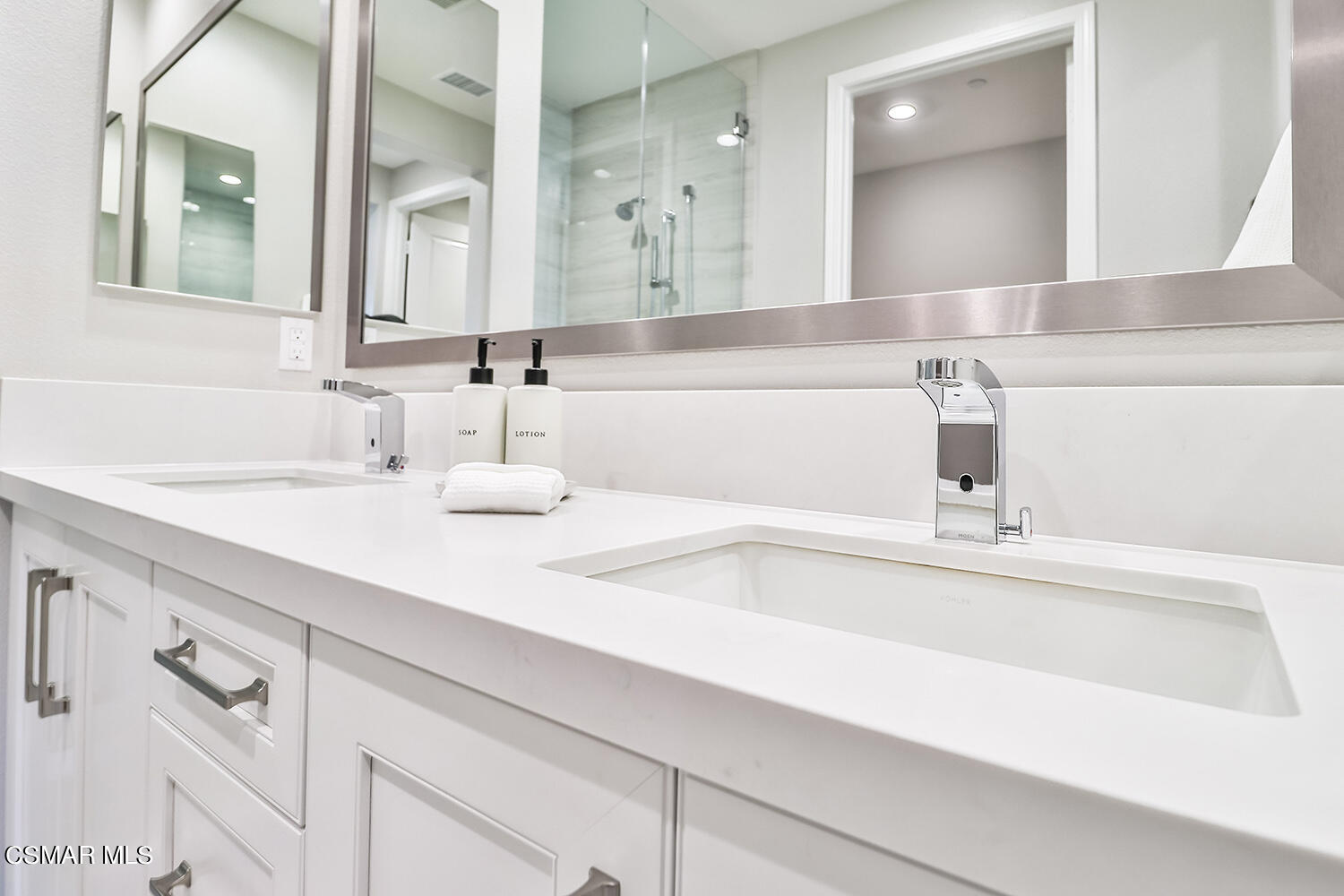 2498 Cherry Tree Drive Camarillo, CA 93012 - Photo 24 of 67 a bathroom with a sink and a mirror