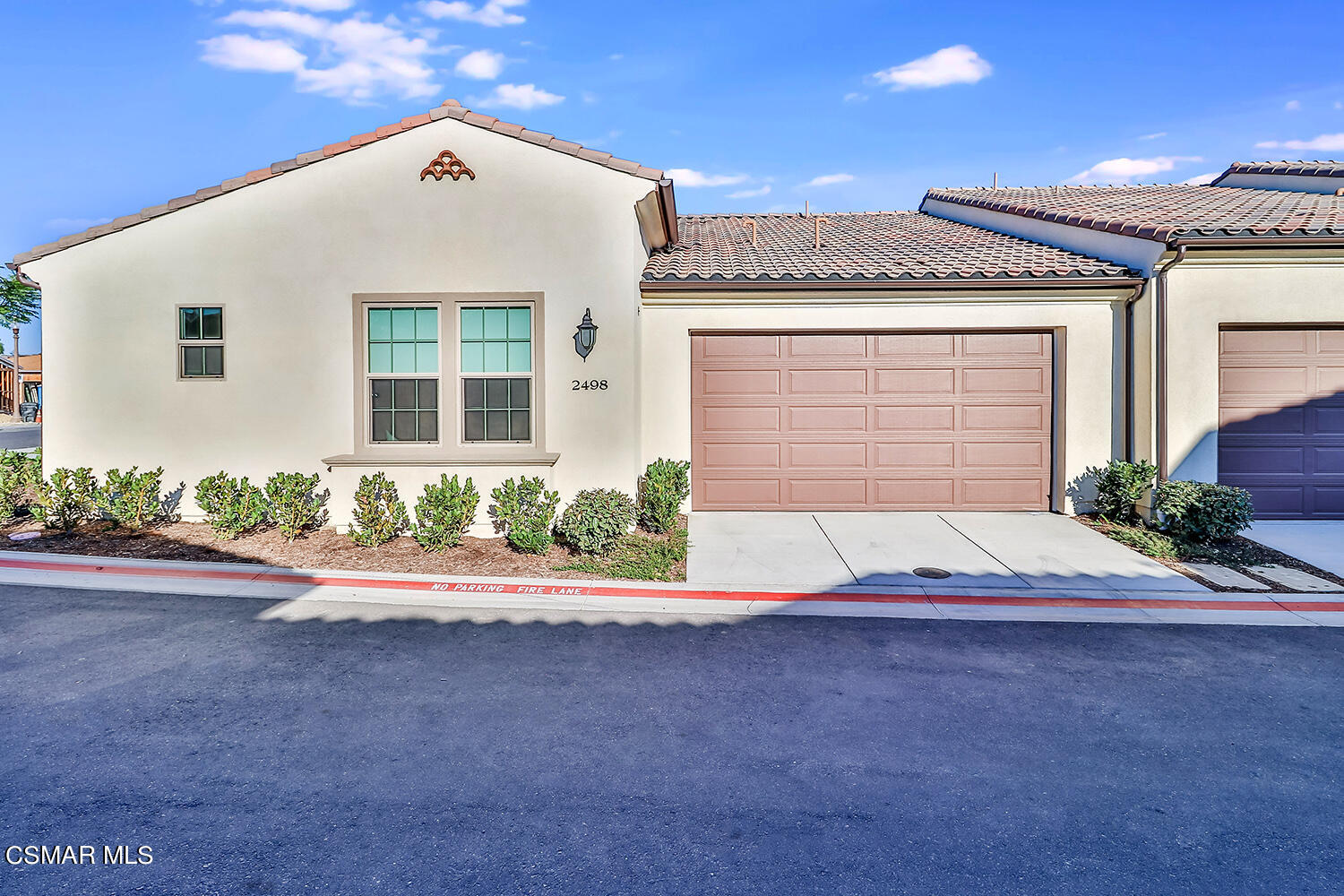 2498 Cherry Tree Drive Camarillo, CA 93012 - Photo 3 of 67 a front view of a house with a yard and potted plants