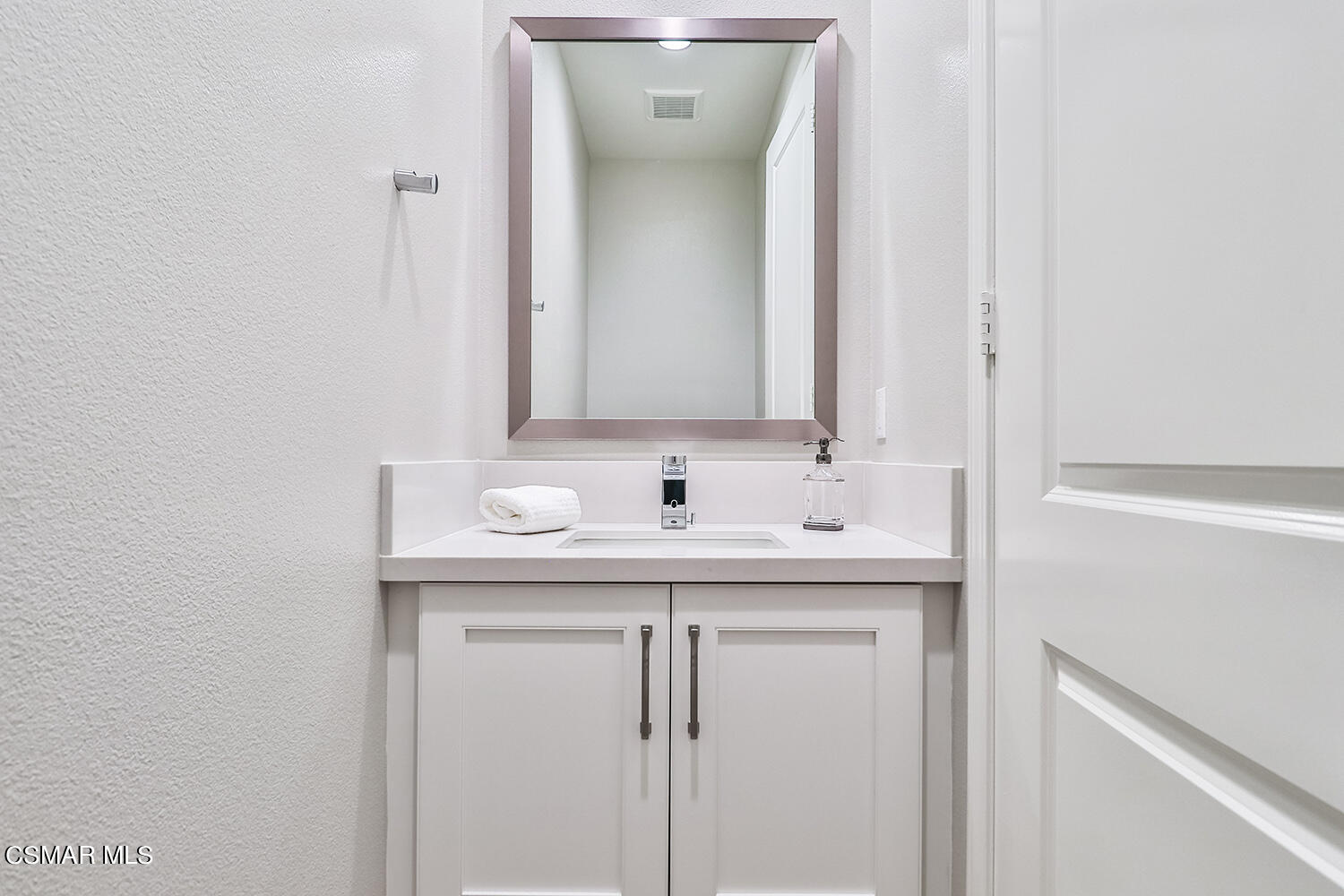 2498 Cherry Tree Drive Camarillo, CA 93012 - Photo 33 of 67 a bathroom with a sink and a mirror