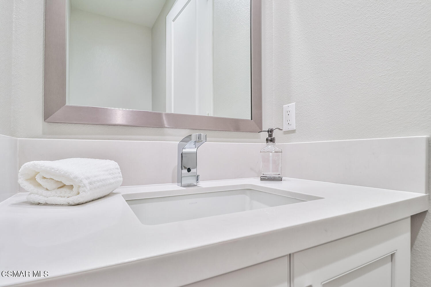 2498 Cherry Tree Drive Camarillo, CA 93012 - Photo 34 of 67 a bathroom with a sink and a mirror