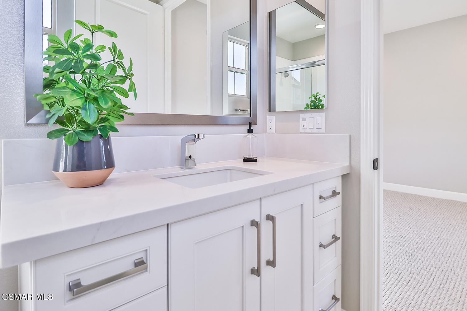 2498 Cherry Tree Drive Camarillo, CA 93012 - Photo 41 of 67 a bathroom with a sink a vanity and a mirror