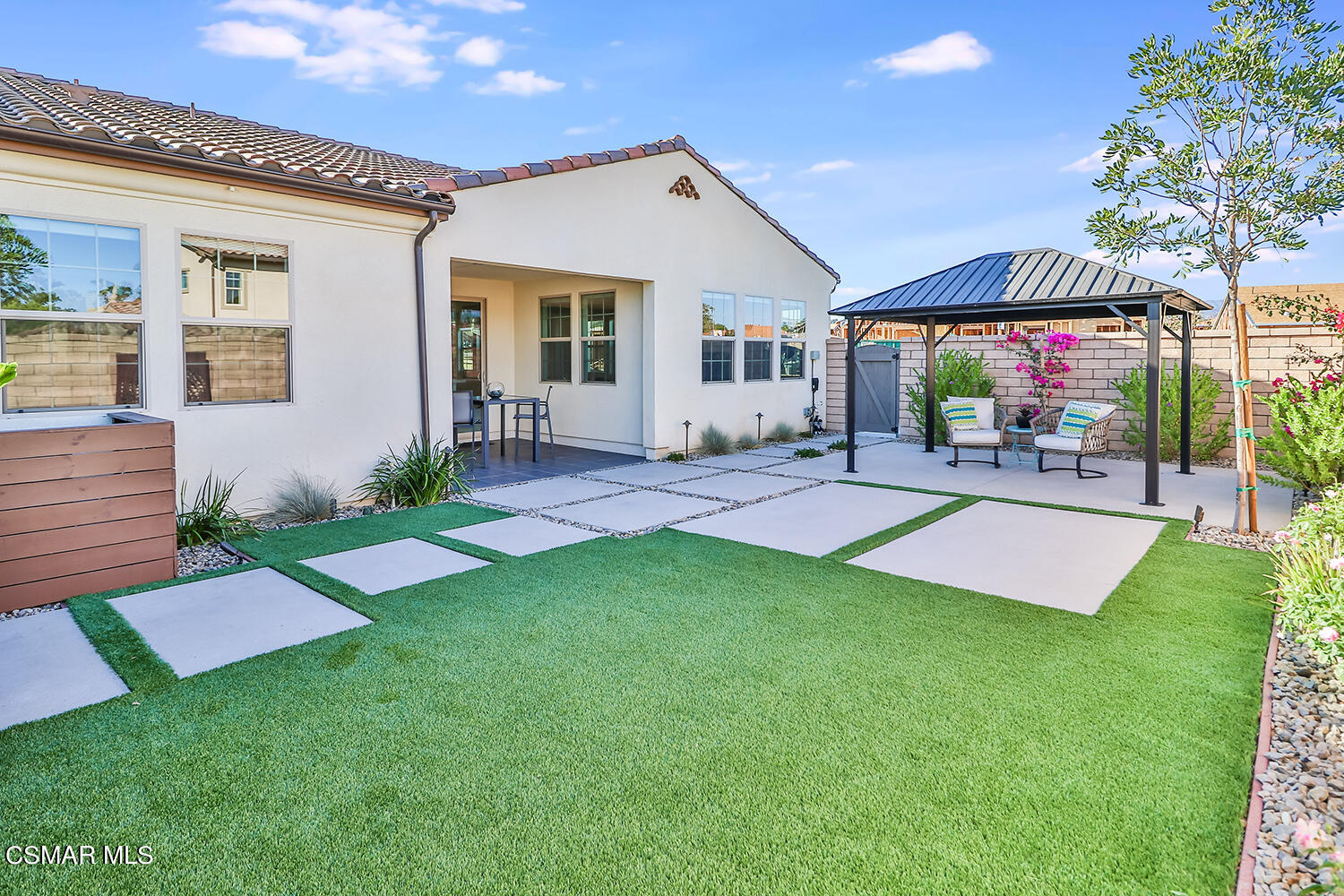 2498 Cherry Tree Drive Camarillo, CA 93012 - Photo 46 of 67 a front view of house with yard and outdoor seating