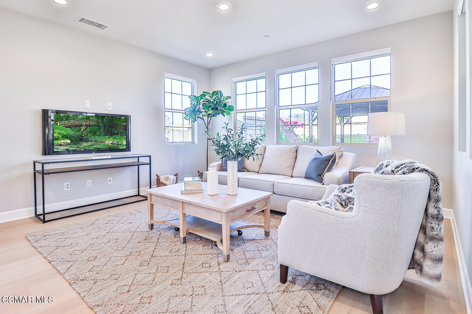 2498 Cherry Tree Drive Camarillo, CA 93012 - Photo 10 of 67 a living room with furniture a large window and a flat screen tv