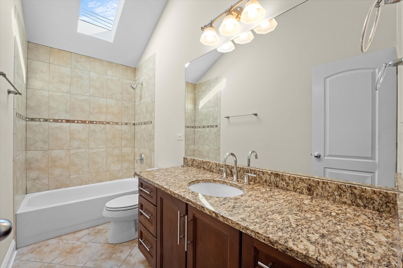 2415 West Palmer Street Chicago, IL 60647 - Photo 15 of 23 a bathroom with a granite countertop sink a toilet and bathtub