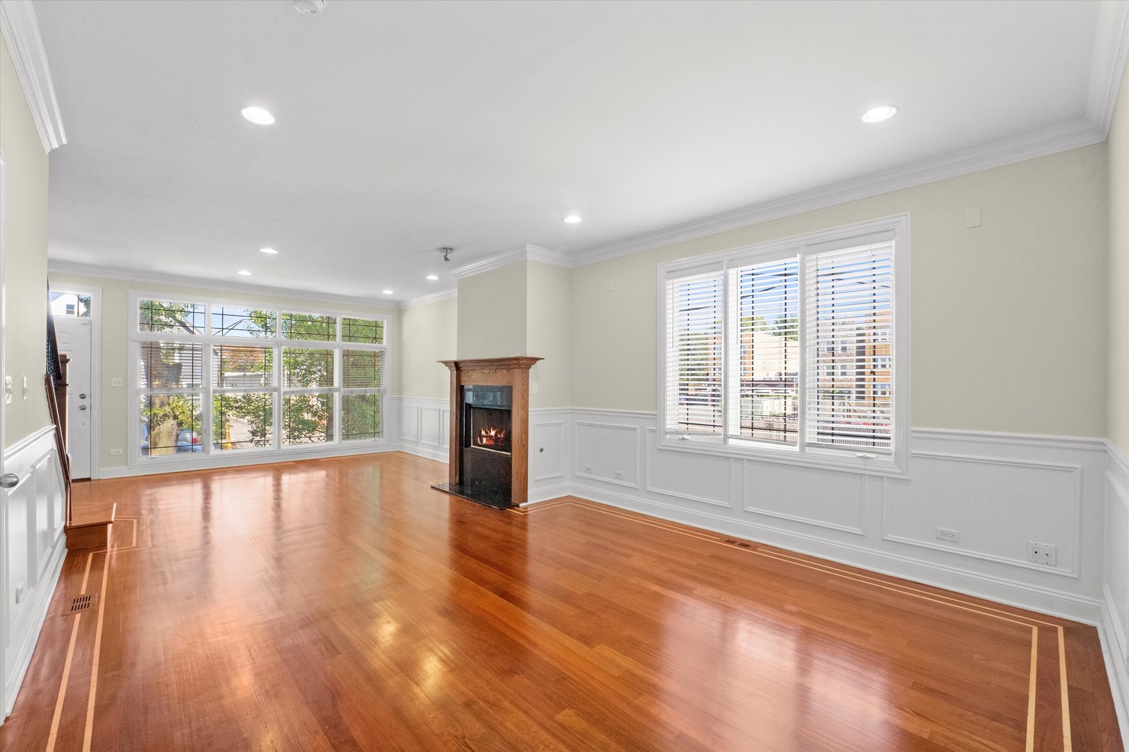 2415 West Palmer Street Chicago, IL 60647 - Photo 2 of 23 a view of an empty room with wooden floor and a window