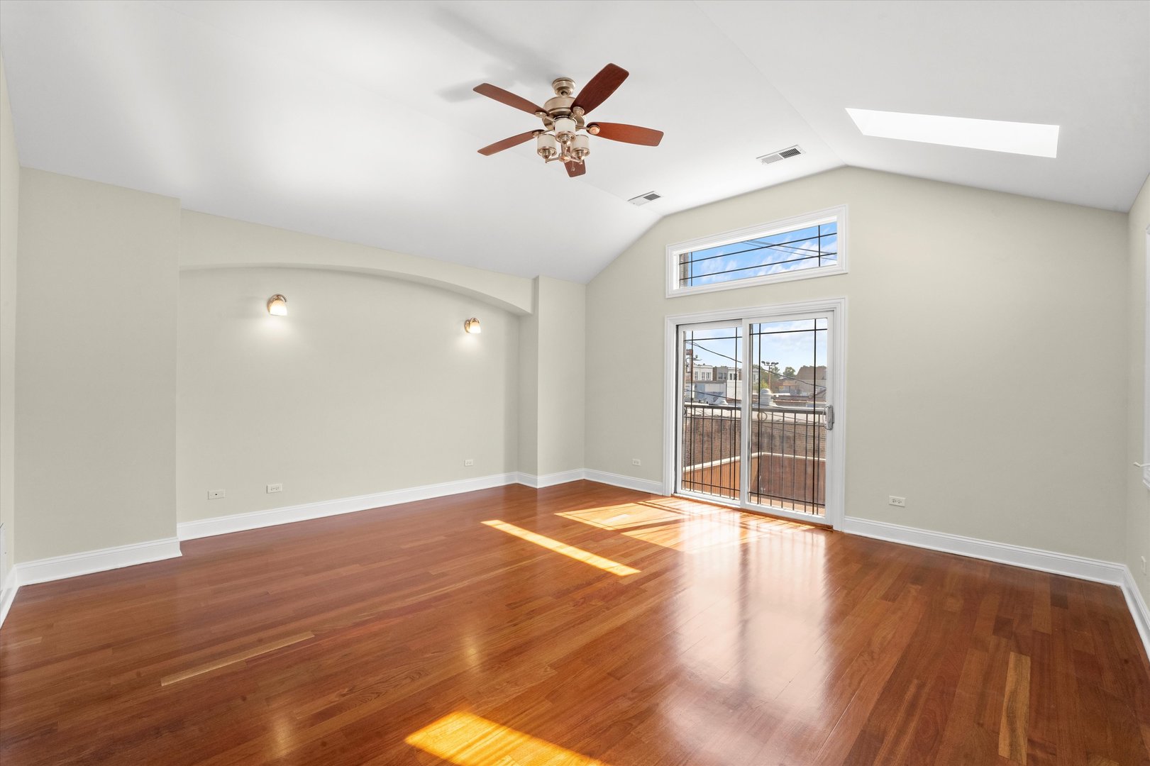 2415 West Palmer Street Chicago, IL 60647 - Photo 9 of 23 an empty room with wooden floor and windows