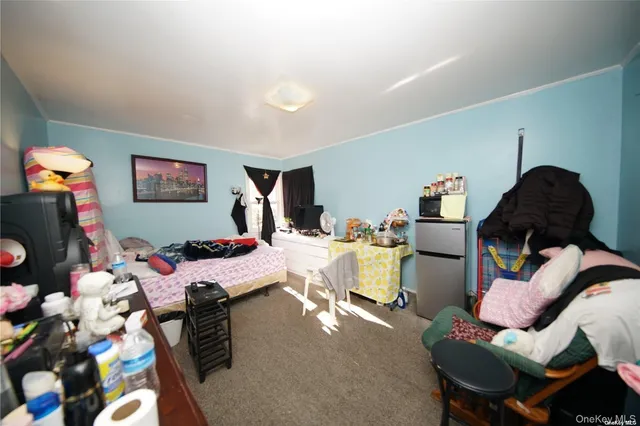 a bed room with a bed and a chair